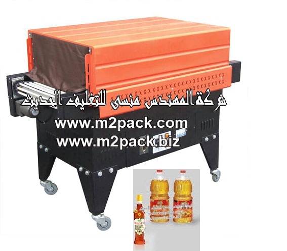 ماكينة تغليف زجاجات زيت السمسم بفيلم الشرينك الحراري